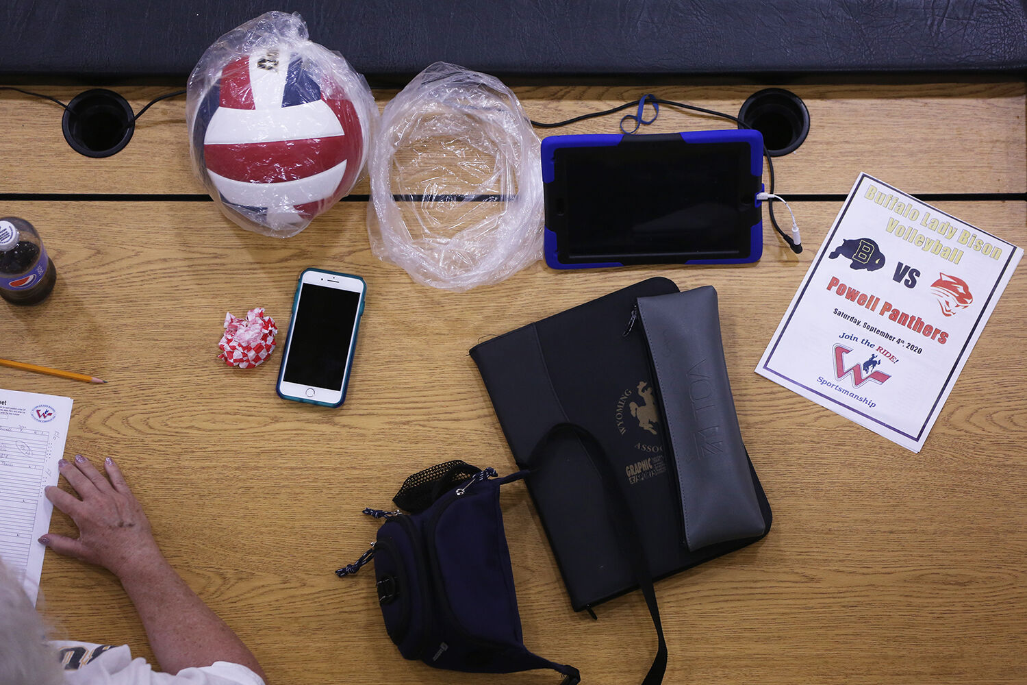 An extra ball sits with the microphone and a program